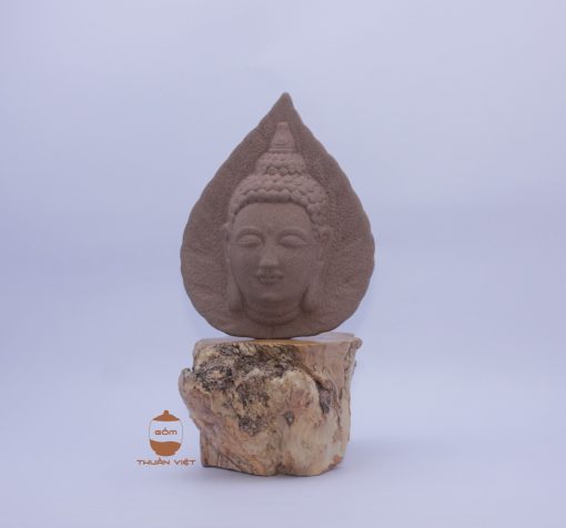 Buddha face in the shape of a bodhi leaf